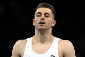 Max Whitlock reacts after his routine on the high bar during the men's team final in Paris. (Photo by Naomi Baker/Getty Images)