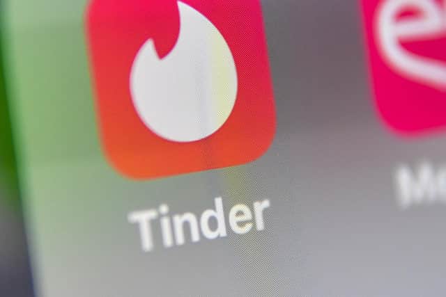 Fraudsters often use dating apps such as Tinder. (Photo by DENIS CHARLET / AFP) (Photo by DENIS CHARLET/AFP via Getty Images)