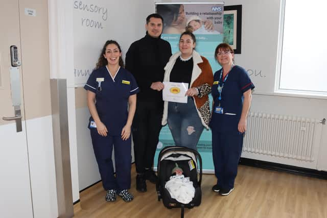 Baby Aris with parents Adrian and Alexandra Blanaru between senior midwives Bianca Baum (left) and Kelly Kinsella (right). Photo: WHTH