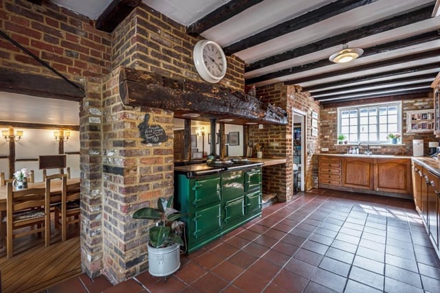 The kitchen has a four oven AGA which opens through to the family dining space.