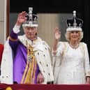 King Charles III and Queen Camilla on the balcony of Buckingham Palace following the coronation on May 6, 2023. Picture: Owen Humphreys/PA Wire.