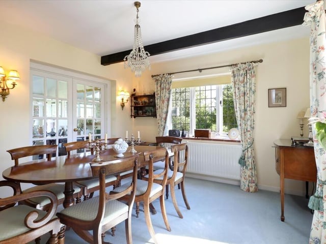 The light and airy dining room is a double aspect room and opens out on to the stunning garden room with doors leading to the gardens.