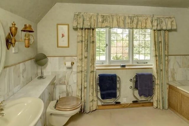 One of six bathrooms in the property, all first floor bedrooms in the main building are en-suite.