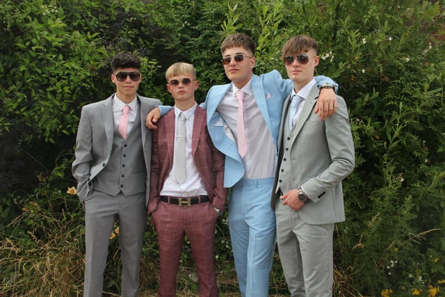 The pupils turned up the prom in suits and sunglasses.