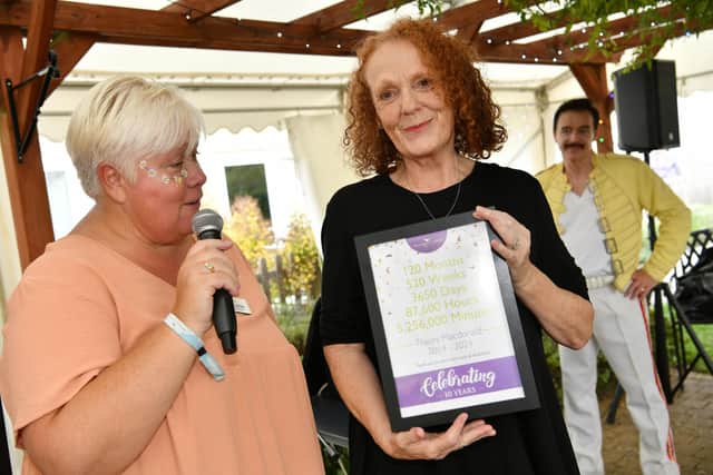 Home manager Victoria Forsythe recognises the team members who have worked at Water Mill House for 10 years
