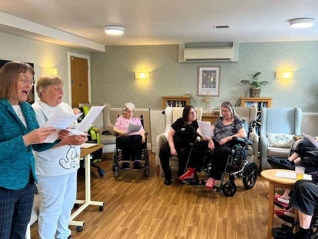 Residents at St Pauls Care Centre enjoying regular services, singing hymns with Adeyfield Church