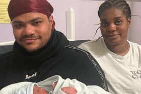 Mfilu Mbongo and Braxely Jamieson with their baby boy.