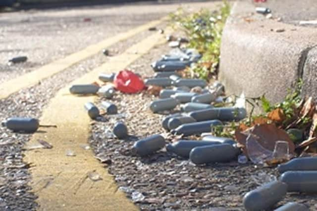 nitrous oxide containers are often seen in parks, photo from Hertfordshire Constabulary