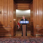 Deputy Chief Medical Officer for England Jonathan Van Tam (left), Prime Minister Boris Johnson (centre) and National Medical Director of NHS England Professor Stephen Powis (right) speaking at a press conference in 10 Downing Street, London, following the tightening of England's Covid-19 tiers.