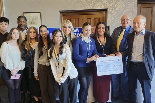 Team Horizon from John F Kennedy School presenting a cheque to their charity The Pepper Foundation