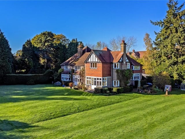 On the market with Ashtons in Berkhamsted, this property has six bedrooms and six bathrooms and has a guide price of £2,750,000. Tucked away in around three acres of Bovingdon land, this house has 4,500 square feet, outbuildings and a paddock.