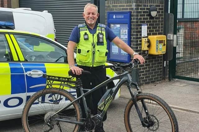 PCSO Graham Warner with his bike.