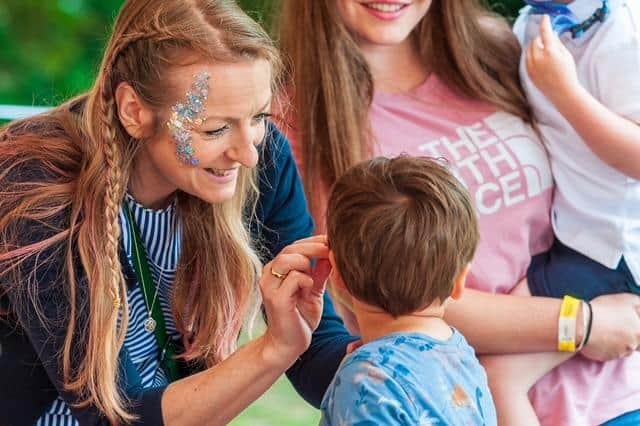 Face-painting has proved popular at the Hertfordshire festival, photo from Guy Mayer