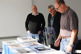 Club members prepare for their third photography exhibition