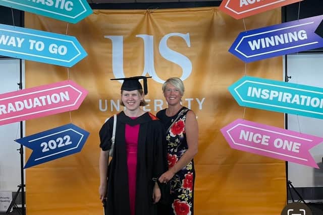 Jess stands with her mum, Jo, at her Masters graduation