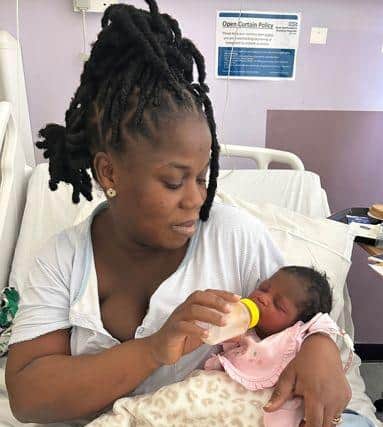 Mum feeding new born baby using SteriFeed bottle