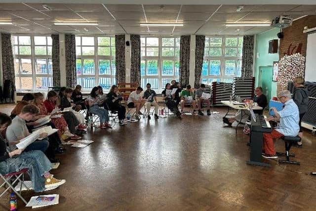 The cast hard at work with Fred, Rachael, and Richard.