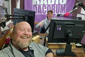 Joel being shown the radio ropes by station manager Matt.