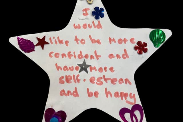 Paper star decorated with stickers and wording: I would like to be more confident and have more self-esteem and be happy