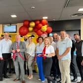 Sir Mike Penning MP cuts the ribbon at the restaurant.