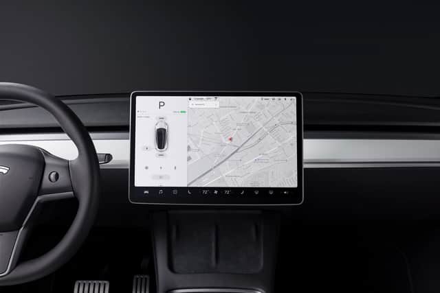 The minimalist interior feels a class above but the touchscreen is a veritable Aladdin's cave for tech-heads. Photo: TESLA