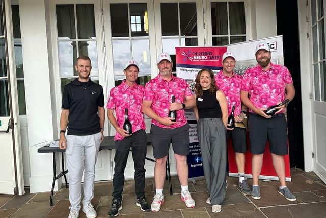 The winning team – 2 Gunners 2 Cannons – celebrating their win with Charlie Hicks from EIC Insurance and Stella Kubale from the Chilterns Neuro Centre.