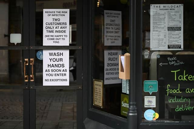 Signs in a coffee shop in Main Street Fort William as people are asked to stop travelling to the Scottish Highlands in a bid to avoid spreading the coronavirus (Photo: Jeff J Mitchell/Getty Images)