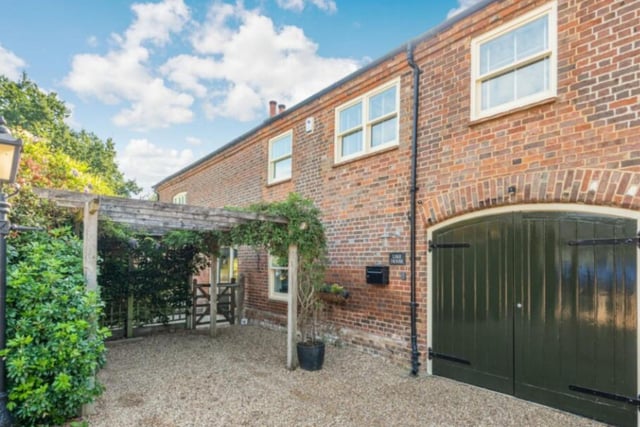 These stable doors serve as the entrance to the garage, perfect for keeping your vintage motor out of the rain and in pristine condition