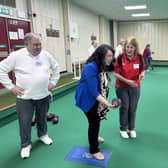 Victoria trying her hand at Bowls during her visit to Harpenden & District Indoor Bowling Club