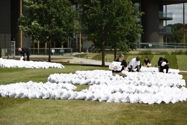 England’s Lionesses got a mighty send-off as they prepare to depart for their biggest tournament of the year - a massive tribute made entirely from towels. The monumental display featuring a roaring Lioness, 41 metres wide and 29 metres high is made of nearly 10,000 fanned, folded and rolled towels.