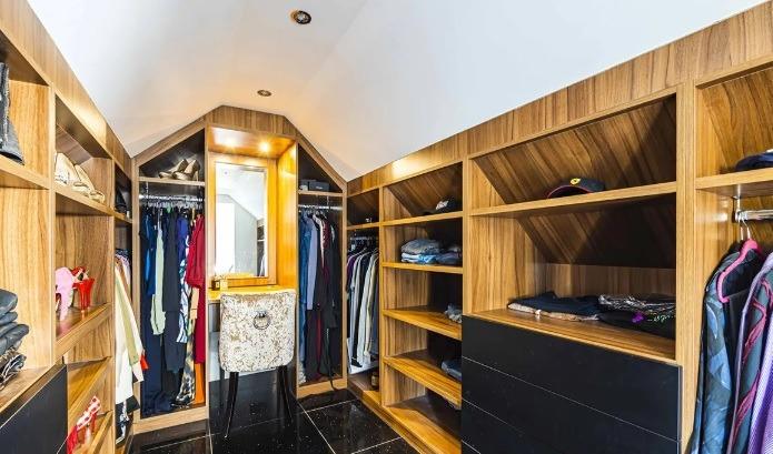 Next to the first floor bedroom is a spacious walk-in dressing room.