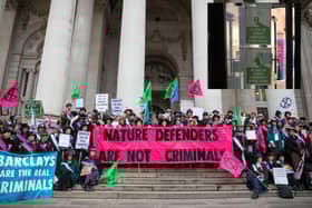 Suffragettes outside of Southwark Crown Court, inset: stickers on Hemel Hempstead Barclay's doors