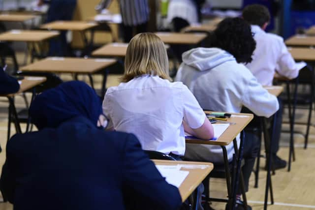 High school pupils sitting exam.