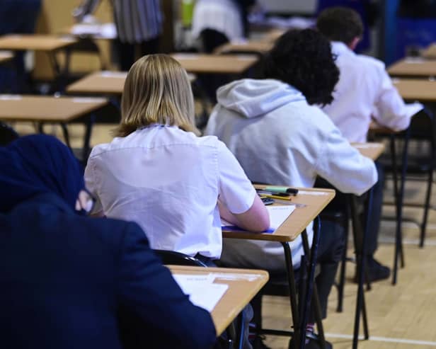 High school pupils sitting exam.