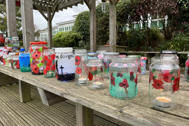 A remembrance service was held at South Hill school in Hemel Hempstead. The school had created a garden of painted jars for the occasion.
