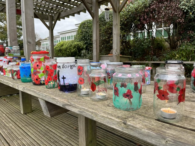 A remembrance service was held at South Hill school in Hemel Hempstead. The school had created a garden of painted jars for the occasion.