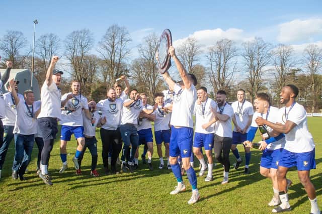 Champions Berkhamsted lift their trophy. (Photo: Berkhamsted FC)
