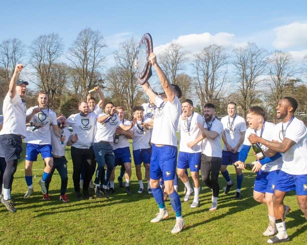 Champions Berkhamsted lift their trophy. (Photo: Berkhamsted FC)