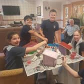 Care UK Knebworth resident Derek Young creating sustainable bird boxes with children from Knebworth Primary & Nursery School for Generations of Change.
