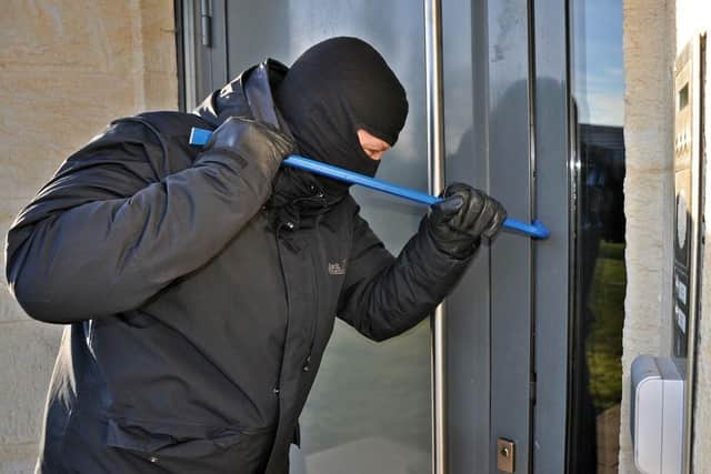 Burglar targeting a home