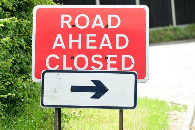 General view of a road ahead closed sign