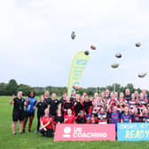 Maggie Alphonsi and the girls took part in a group photo at the end of a child-first coaching session put on by Broughton Park.