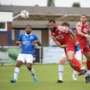 Kyle Ajayi heads clear during Hemel Hempstead's game at Wealdstone. Photo: HHTFC.