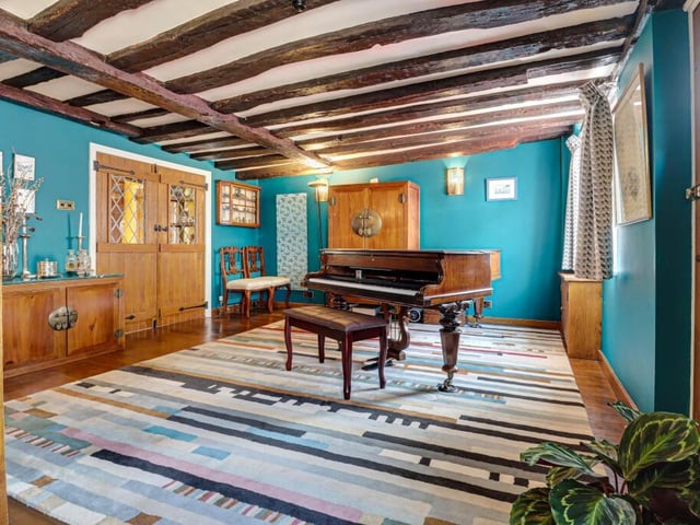 In the other reception room is a huge piano, so there is space to host a fabulous dinner party - followed by songs around your piano.