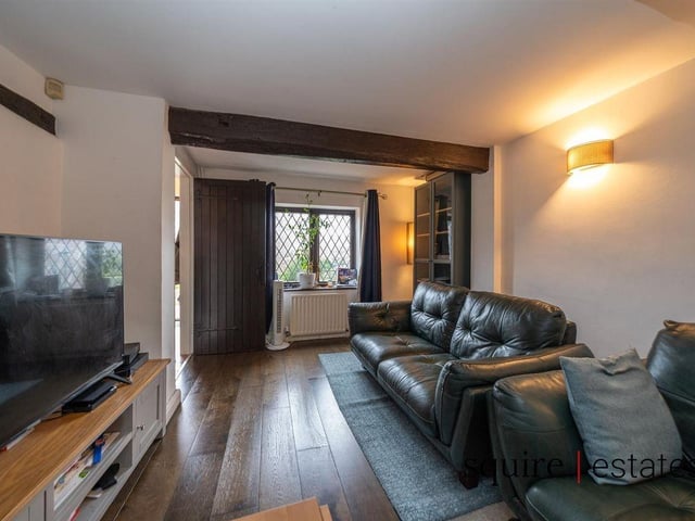 Old meets new in the spacious living area with elements of period charm.