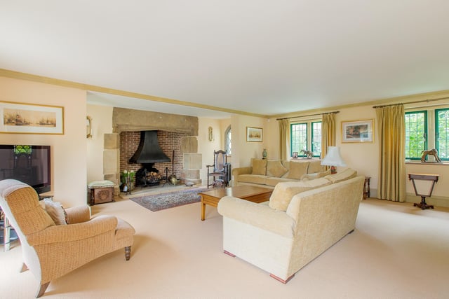 This airy room is filled with character - from the quirky windows to the huge fire place.