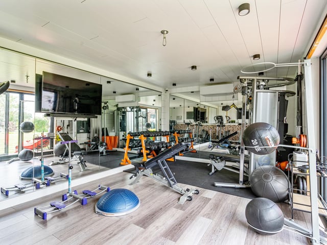Two substantial outbuildings are currently used as a home gym and recording studio respectively. The property backs onto open fields giving a lovely natural vista and sense of rural living.