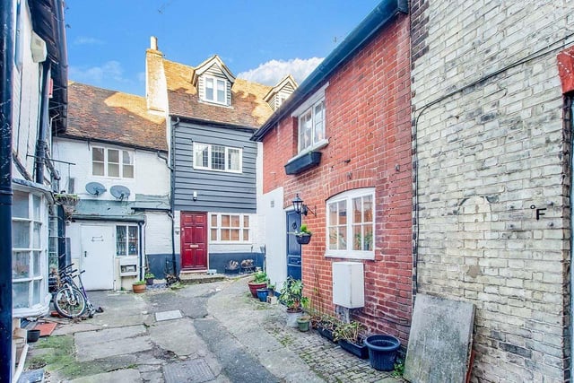 The home is nestled among a charming jumble of period homes.