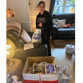 Sima's daughter helping pack parcels last December