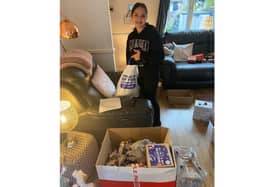 Sima's daughter helping pack parcels last December